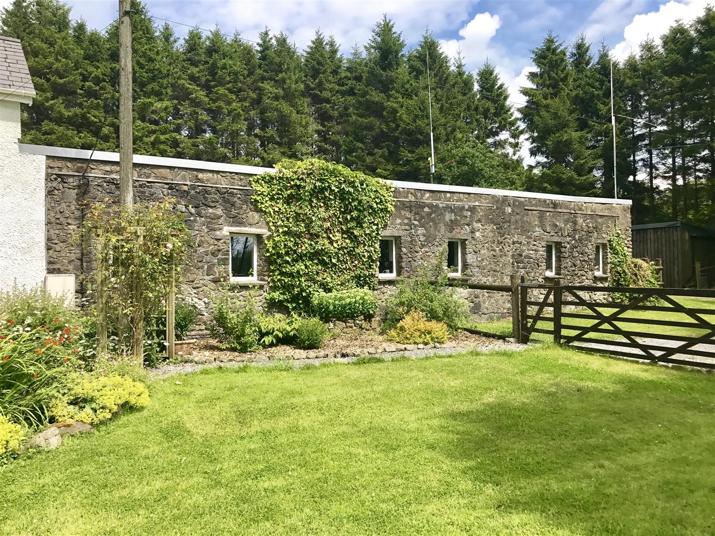THE ADJOINING BUILDING